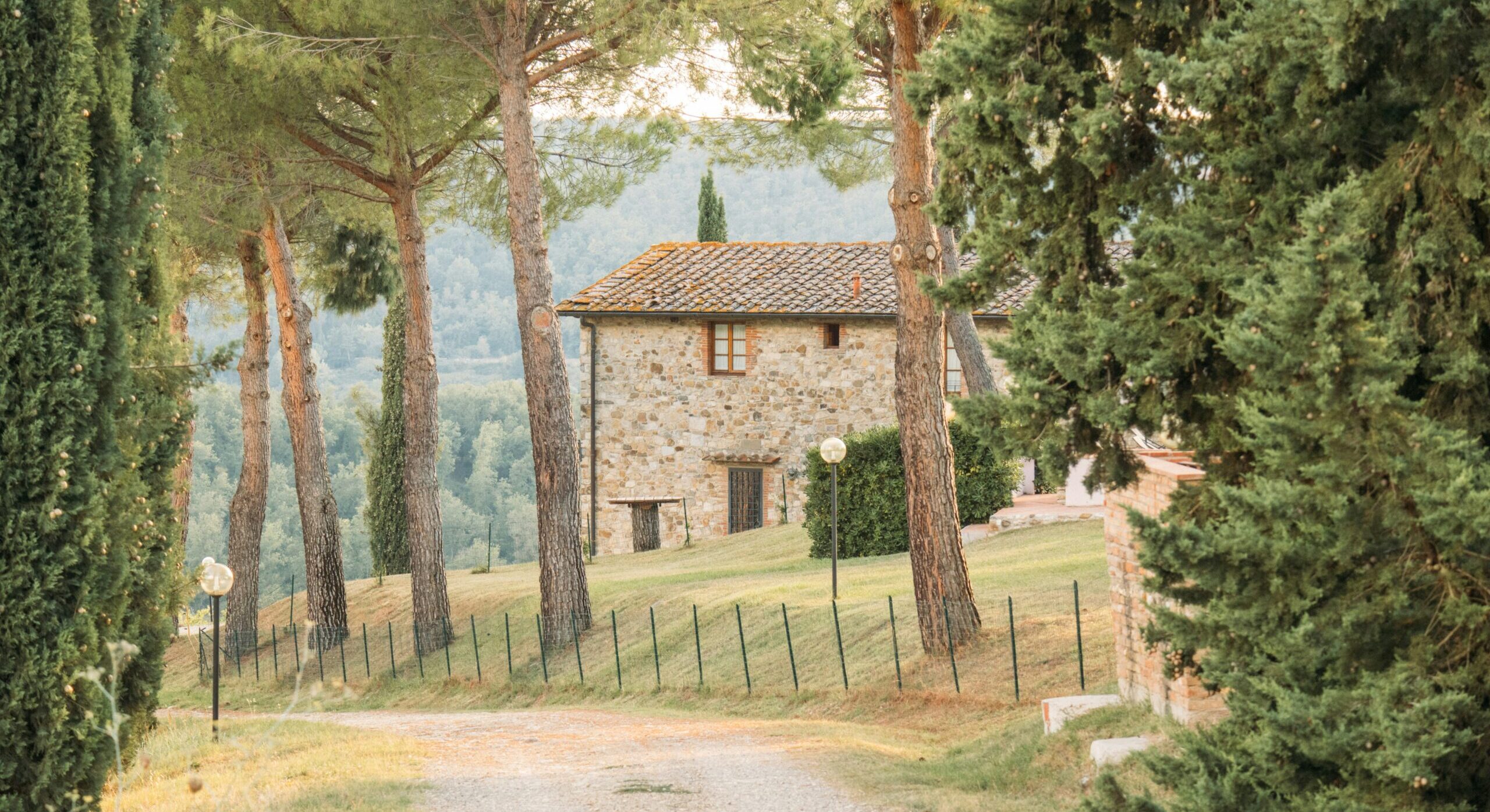 Villa in Tuscany, Italy seen through its trees and drive